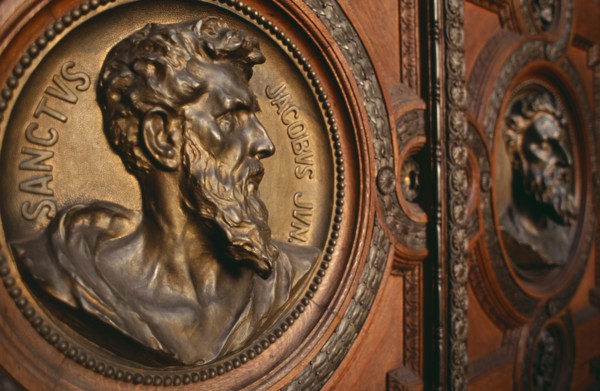 HUNGARY, Budapest, Basilica of St Stephen.  Detail of door with bronze relief carvings of the heads