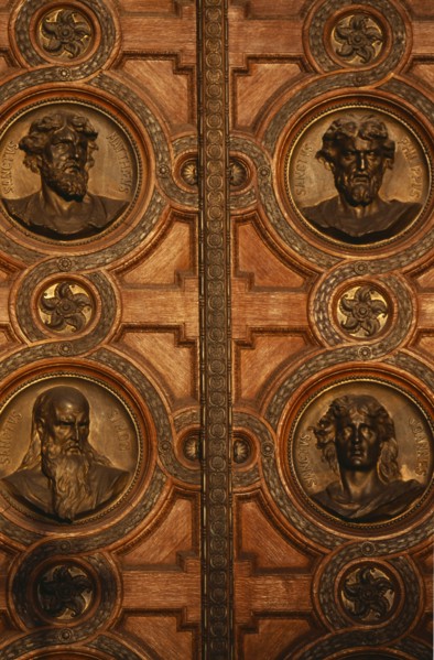 HUNGARY, Budapest, Basilica of St Stephen.  Detail of door with bronze relief carvings of the heads