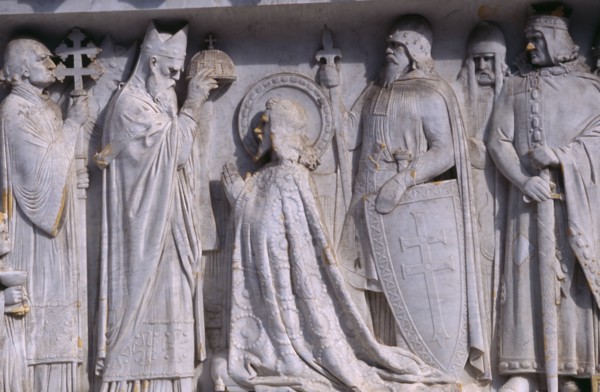 HUNGARY, Budapest, Detail of stone relief carving depicting a coronation on plinth of the