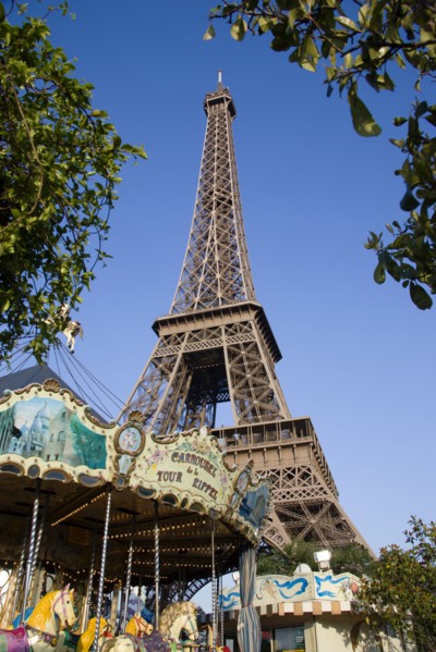 FRANCE, Ile de France, Paris, Funfair carrousel at the base of the Eiffel Tower