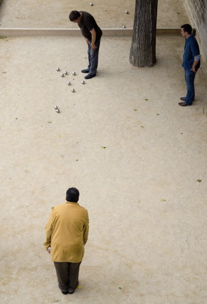 FRANCE, Ile de France, Paris, "Three men playing Boules, or Petanque, beside the River Seine"