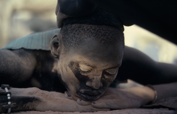 SUDAN, Rumbek, Dinka youth having hair bleached with cattle urine in Majak Asok cattle camp.