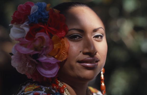 MEXICO, Yucatan, Chichen Itza, Head and shoulders portrait of female singer and dancer wearing silk