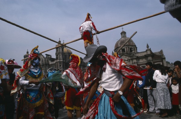 MEXICO, Mexico City, "Our Lady of Guadelope Festival dancers, musicians and acrobats in front of
