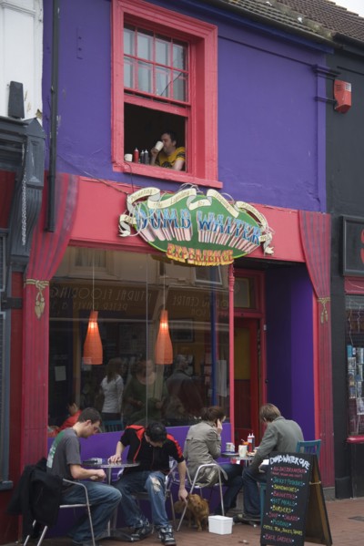 ENGLAND, East Sussex, Brighton, "People sat outside the Dumb Waiter cafe in Sydney street, North