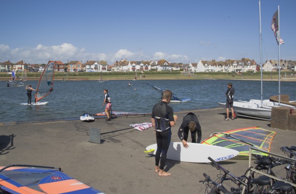ENGLAND, East Sussex, Brighton, Hove lagoon with windsurfers