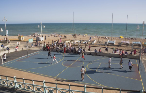 ENGLAND, East Sussex, Brighton, Basketball court on the seafront.