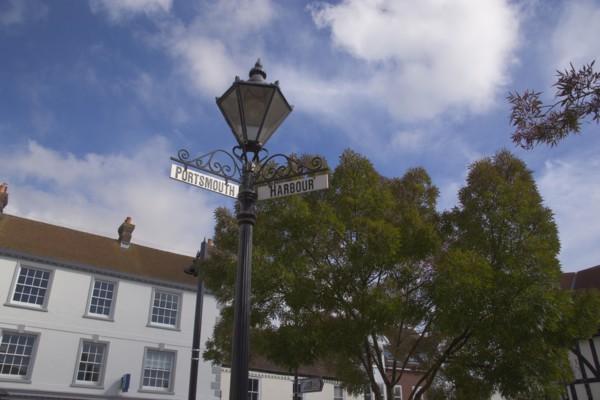 ENGLAND, Hampshire, Emsworth, Main square with signs pointing to Portsmouth and the Harbour.