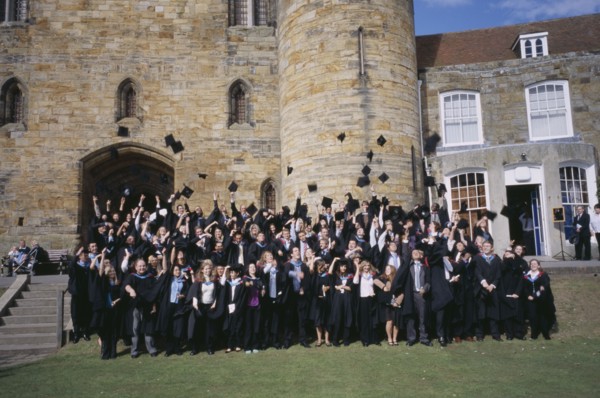 EDUCATION, University, Graduation, "Graduate wearing their mortar boards and gowns, posing for a