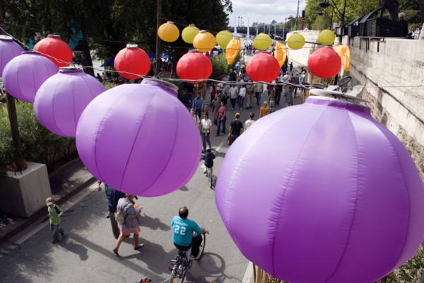 FRANCE, Ile de France, Paris, The Paris Plage urban beach. Colourful lanterns hanging above