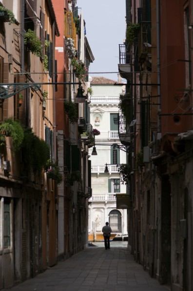 ITALY, Veneto, Venice, View down a narrow street to the Grand Canal in the San Polo and Santa Croce