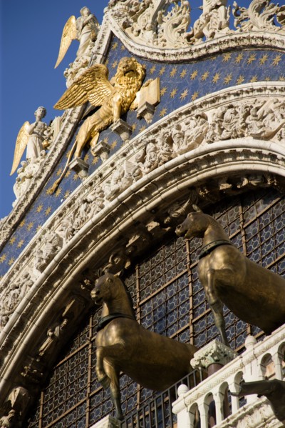ITALY, Veneto, Venice, The bronze Horses of St Mark and the winged Lion of St Mark below Angels on