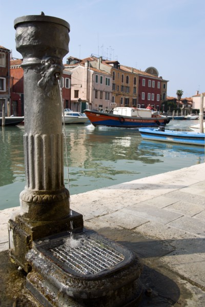 ITALY, Veneto, Venice, A free public drinking water fountain on the Canale di San Donato on the
