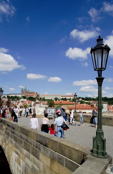 CZECH REPUBLIC, Bohemia, Prague, Tourists on the Charles Bridge across the Vltava River with Prague