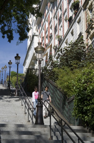 FRANCE, Ile de France, Paris, Montmartre Tourists walking down steps from the church of Sacre Couer