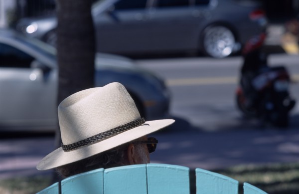 USA, Florida, Miami, South Beach. Ocean Drive. The head of a man wearing a Panama hat seen above