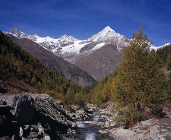 SWITZERLAND, Valais, Weisshorn Mountain, River Taschbach with the Snow capped Weisshorn  Mountain