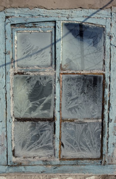 MONGOLIA, Architecture, Detail of window with pale blue painted frame and frost patterns decorating