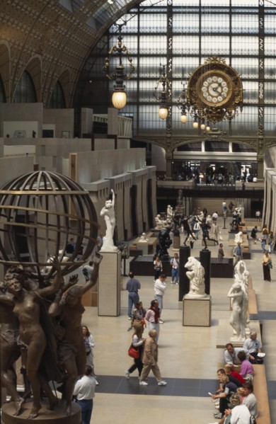 FRANCE, Ile de France, Paris, "Musee d’Orsay interior, visitors walking amongst sculpture inside