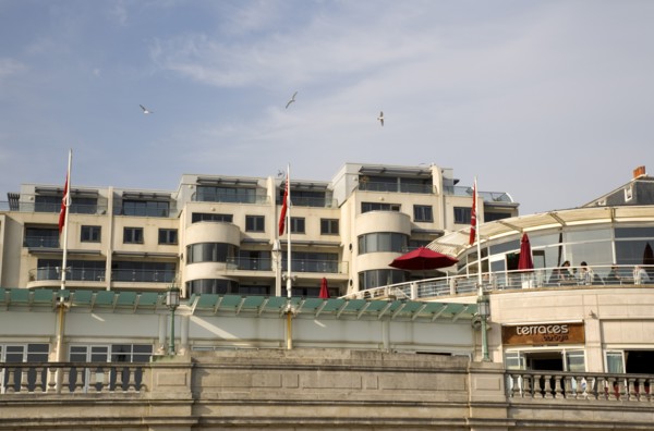 ENGLAND, East Sussex, Brighton, Modern seafront aprtments and restaurants on Marine Parade.