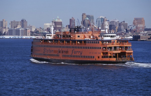 USA, New York, New York City, Staten Island ferry with city skyline beyond.