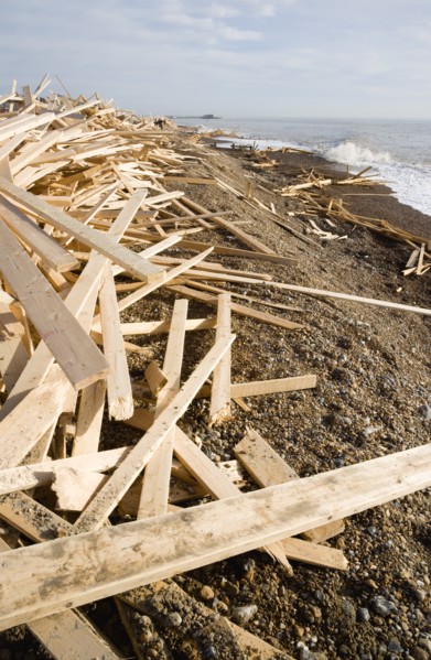 ENGLAND, West Sussex, Worthing, Timber washed up on the beach from the Greek registered Ice