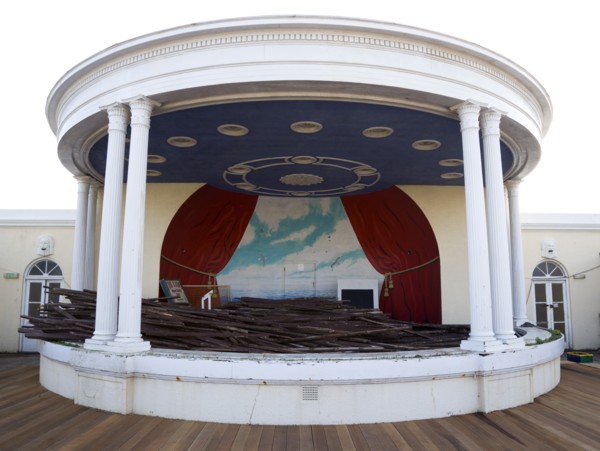 ENGLAND, West Sussex, Worthing, Piles of old decking in the bandstand on the day that timber was