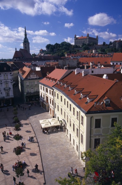 SLOVAKIA, Bratislava, "View over paved square and cafe, across red tiled rooftops of the Old Town