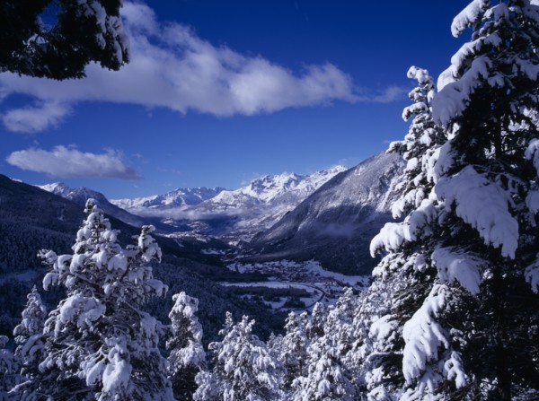FRANCE, Provence-Cote d’Azur, Hautes-Alpes, View west from Col de Montgenevre over snow covered