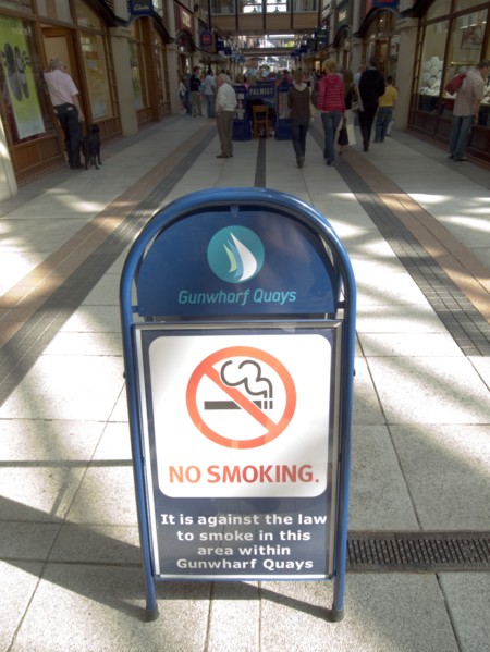 ENGLAND, Hampshire, Portsmouth, No Smoking sign in the Gunwharf Quays shopping complex