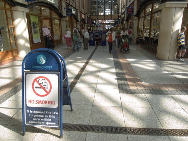ENGLAND, Hampshire, Portsmouth, No Smoking sign in the Gunwharf Quays shopping complex