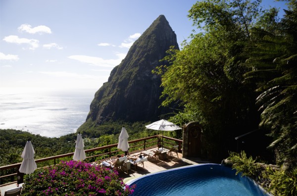 WEST INDIES, St Lucia, Soufriere , Val des Pitons Tourists sunbathing on the sun deck beside the