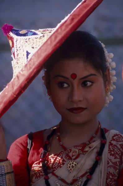 INDIA, Rajasthan, Jaipur, Portrait of female dancer with conical hat at the Jaipur Heritage