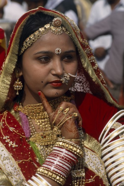 INDIA, Rajasthan, Jaisalmer, "Portrait of a Miss Desert contestant with henna painted hands, finger