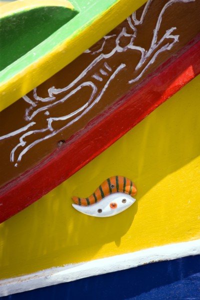 MALTA, Marsaxlokk , Fishing village harbour on the south coast with colourful Kajjiki fishing boat