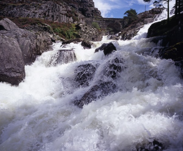 WALES, Gwynedd, Snowdonia National Park, Ogwen Falls and Nant Ffrancon Pass.   White foaming water