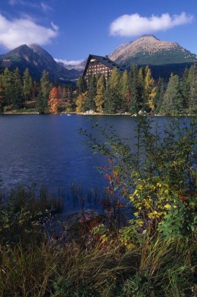 SLOVAKIA, Carpathian Mtns, High Tatras Mtns, Strbske Pleso.  View across lake towards chalet and