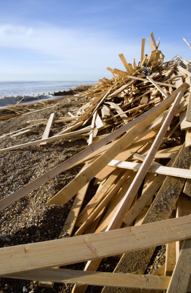 ENGLAND, West Sussex, Worthing, Timber washed up on the beach from the Greek registered Ice