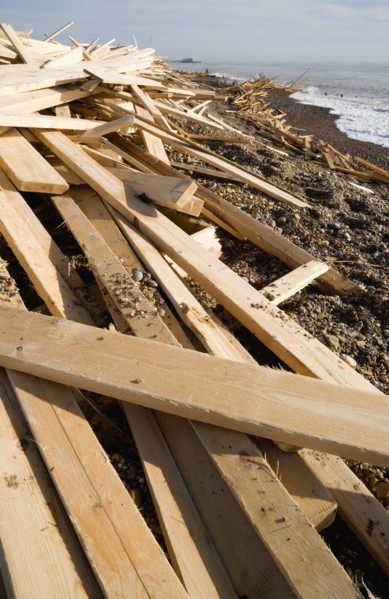 ENGLAND, West Sussex, Worthing, Timber washed up on the beach from the Greek registered Ice