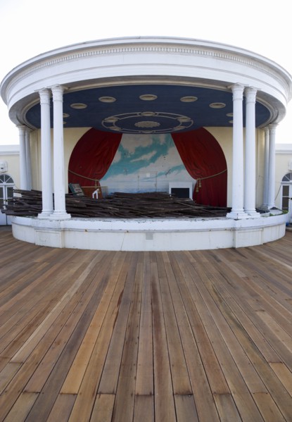 ENGLAND, West Sussex, Worthing, New decking with the bandstand full of old planks the day timber