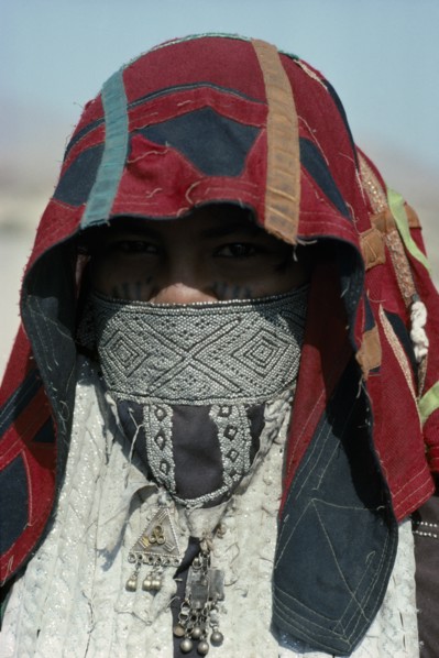 SUDAN, East, People, Head and shoulders portrait of Rasheida nomadic woman wearing embroidered and