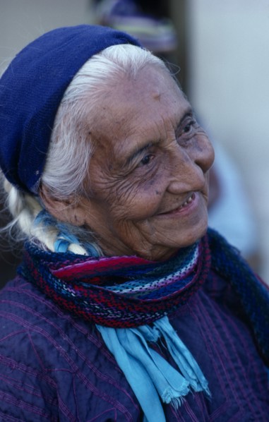 MEXICO, Oaxaca, Juchitan, Matriarchal society.  Head and shoulders portrait of elderly woman with