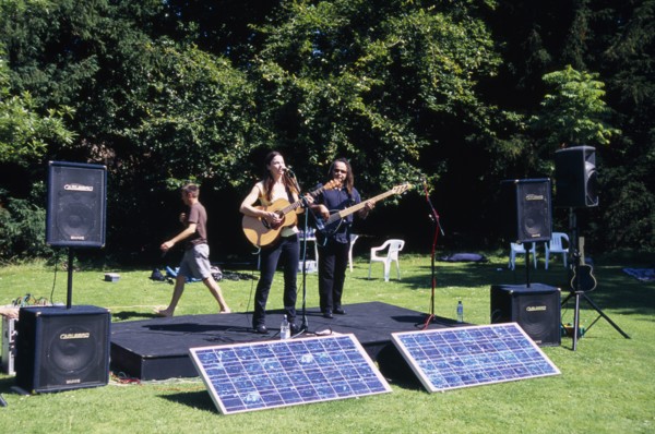 ENGLAND, East Sussex, Lewes, Guitar festival performers with solar powered amplifier systems.