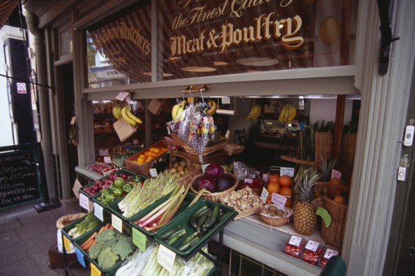 ENGLAND, East Sussex, Hastings, Old Town Butchers on George Street.  Shop frontage with fruit and