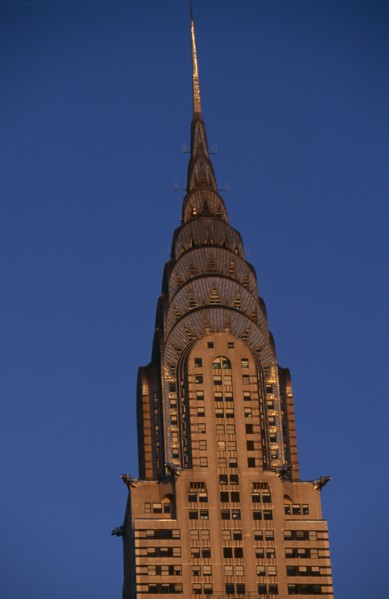 USA, New York, New York City, Part view of the Chrysler Building from East 42nd Street lit by