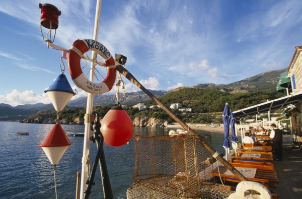 MONTENEGRO, Przno, Waterfront restaurants with fishing nets and nautical decoration looking out