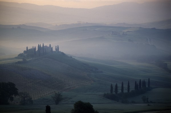 ITALY, Tuscany, San Quirico, View over The Belvedere in early morning mist