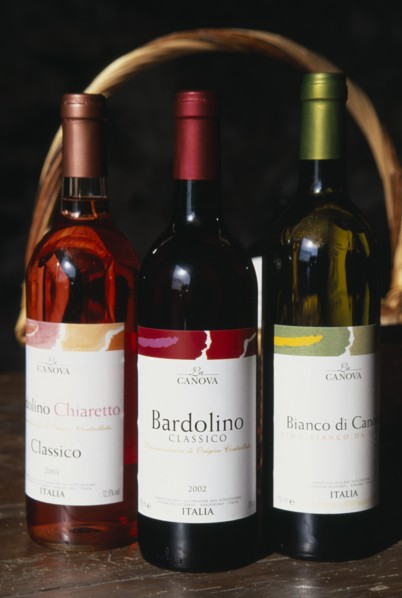 ITALY, Veneto, Lake Garda, "Bardolino.  Bottles of red, white and rose wine from the Bardolino