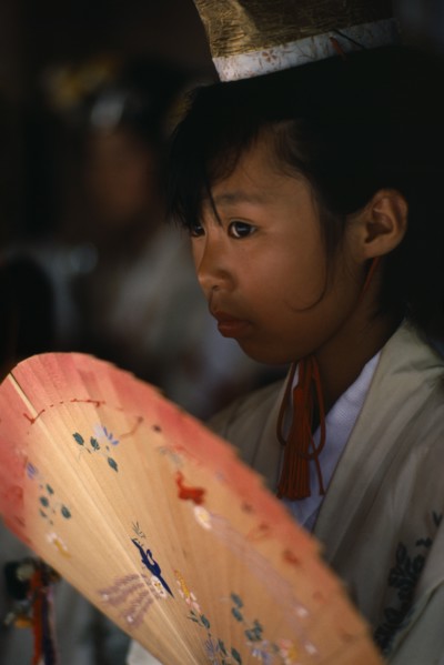 JAPAN, Kyushu, Kaseda Shrine, "Portrait of young shrine maiden employed to welcome visitors,