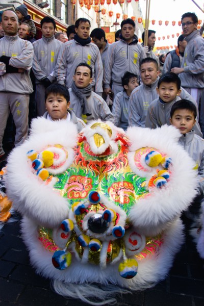 ENGLAND, London, Chinatown, Lion Dance troupe performing in Gerrard Street during Chinese New Year